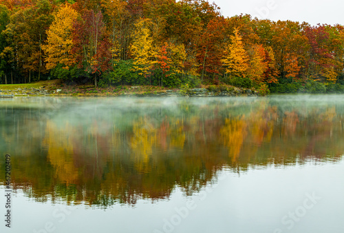 Fall Color Reflections on The Misty Surface Of Boley Lake, Babcock State Park, West Virginia, USA