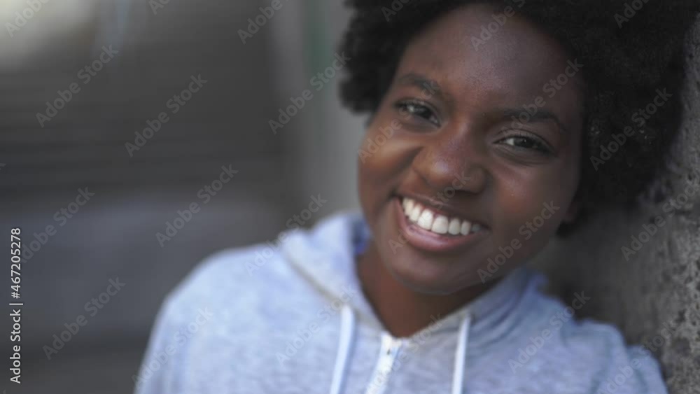 Portrait of a thoughtful black mixed race african female on concreate place