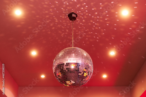 Red disco mirror ball in the club party