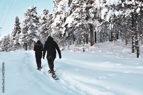 person walking in snowshoe  photo