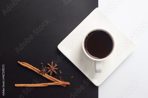 Americano with cinnamon sticks and coffee beans