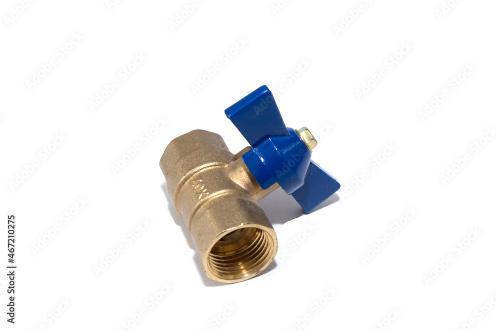 Plumbing ball valve, brass for shutting off water on an isolated background. Cold water tap with blue bow tie. Plumbing ball valve, brass for shutting off water on an isolated background. Cold water tap with blue bow tie.