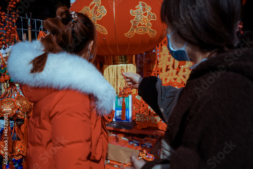 Back view of women looking at chinese decoration photo