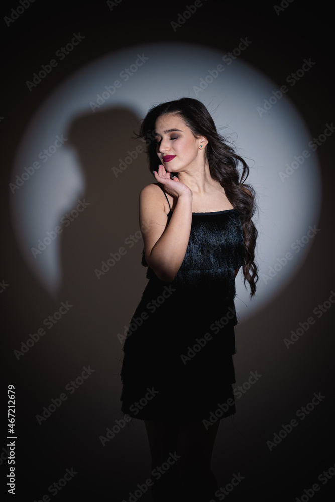 Romantic image of a girl on a date. Photo of a girl in a light scene. Girl with bright makeup. Romantic image of a girl on a date. Photo of a girl in a light scene. Girl with bright makeup.