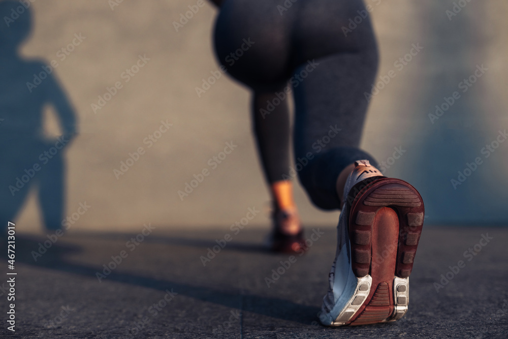 Fitness woman doing lunges exercises to train leg muscles, girl doing one leg lunge exercise for buttocks Fitness woman doing lunges exercises to train leg muscles, girl doing one leg lunge exercise for buttocks