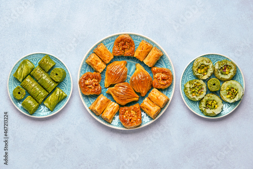 Traditional turkish, arabic sweets baklava assortment with pistachio nuts. Top view photo
