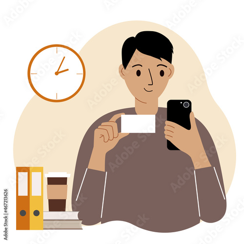 A man holds a bank card in one hand and a mobile phone in the other. Concept of online credit, deposit, payment, debit.