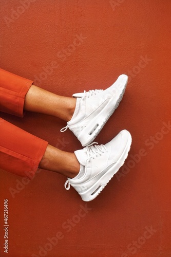 Person wearing light sneakers photo
