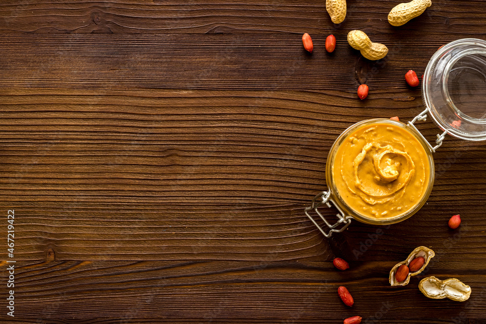 Homemade creamy peanut butter with nuts, top view Homemade creamy peanut butter with nuts, top view