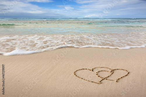 Two love hearts on the caribbean beach.