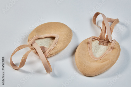 Shoes for rhythmic gymnastics on socks, semi-cylindrical nude-colored shoes photo