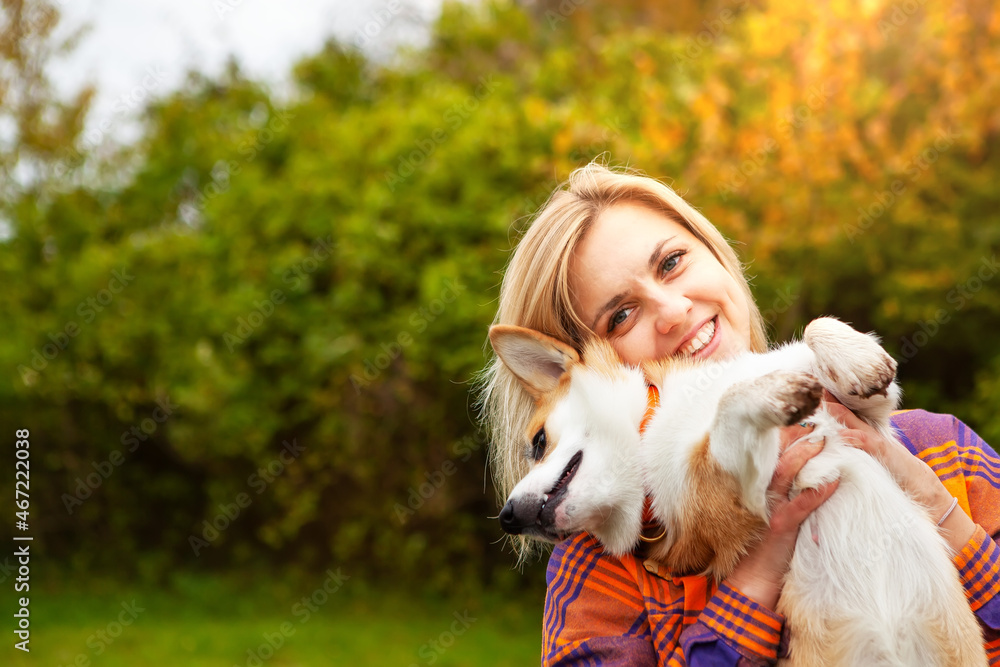 Portrait of a woman with a dog corgi breed. Portrait of a woman with a dog corgi breed.