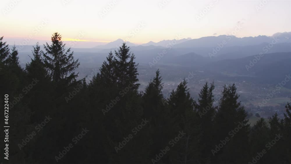 Tatra Mountans seen from above. Autumnal landscape with trees silhouettes and hills. Town in the valley Tatra Mountans seen from above. Autumnal landscape with trees silhouettes and hills. Town in the valley