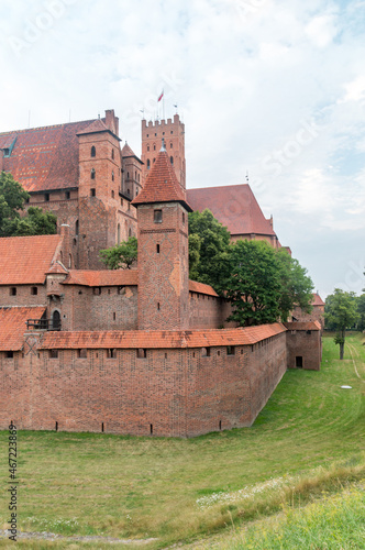 High Castle of Castle of the Teutonic Order at cloudy day in Malbork, Poland. Malbork Castle is the largest castle in the world measured by land area.