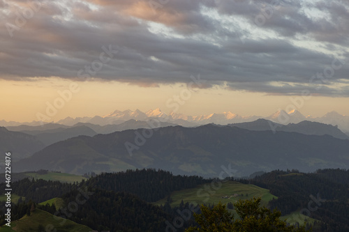 Fototapeta Naklejka Na Ścianę i Meble -  Amazing sunset at a wonderful landscape in Switzerland on a hill called Napf. Wonderful morning view with the alps in the horizon.