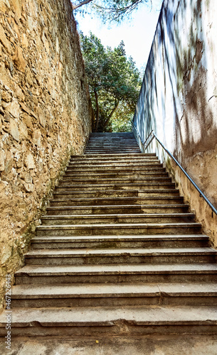 Stone stairs in old park at sunset