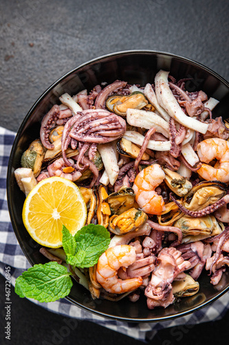 seafood mix shrimp, squid, mussel, octopus fresh meal snack on the table copy space food background 