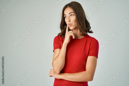 brunette holding hair posing fashion red t-shirt studio