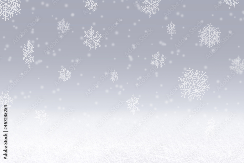 Winter snowfall digital background. Snowflakes falling against a blue / grey sky backdrop. With space for copy or a digital product mockup.