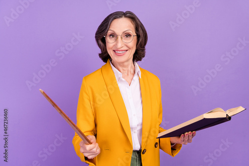 Photo of clever librarian grey old lady read book point wear eyewear yellow jacket isolated on purple color background