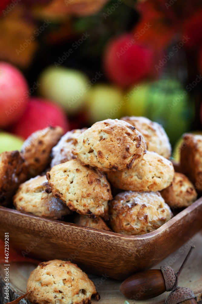 Homemade delicious apple cookies on rustic autumn background
