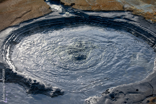 Landscape of Mt. Námafjall black steaming Fumaroles boiling mud pit Diamond Circle Iceland photo