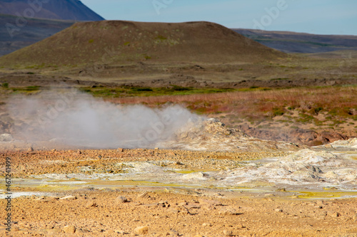Landscape of steaming rocks at Mt. Námafjall Fumaroles boiling mud pit Diamond Circle Iceland