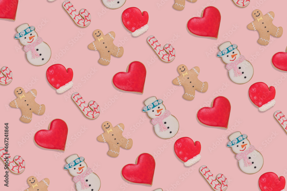 Creative Christmas pattern made with homemade Gingerbread cookies isolated on pastel pink  background.