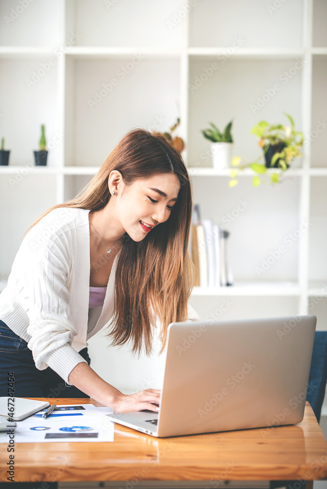 business woman work in the business office on the desk business woman work in the business office on the desk