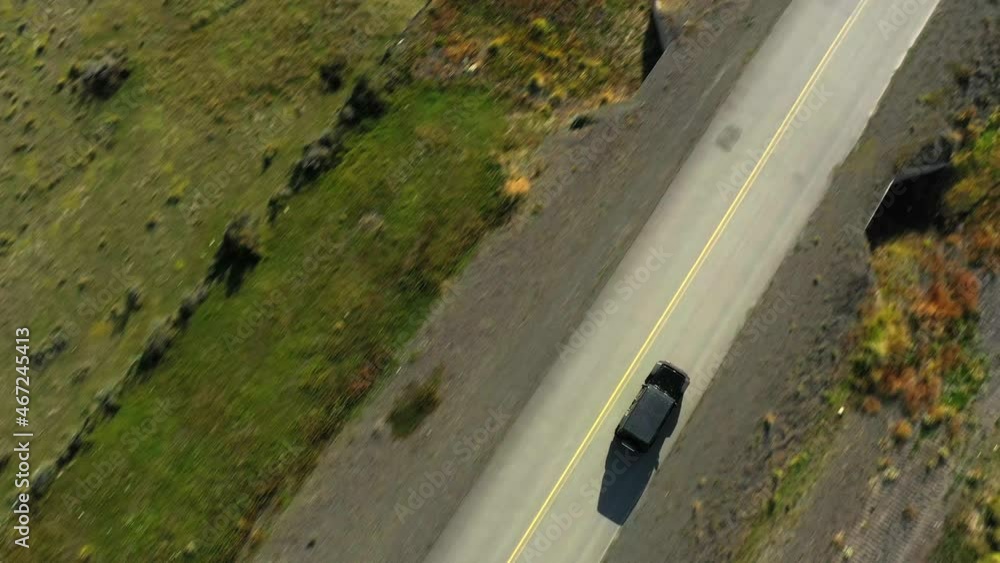 Aerial: Vehicle Moving On Road Amidst Landscape In Sunlight - Puerto Natales, Chile Aerial: Vehicle Moving On Road Amidst Landscape In Sunlight - Puerto Natales, Chile