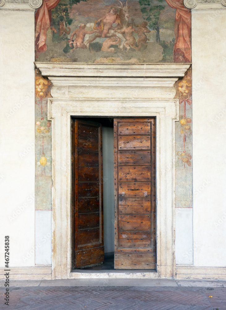 Wooden doorway and frescoes at Villa Giulia, Rome, 2021.