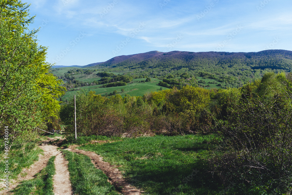 Mountain trail among fields and forests, Bieszczady Mountains, Poland Mountain trail among fields and forests, Bieszczady Mountains, Poland
