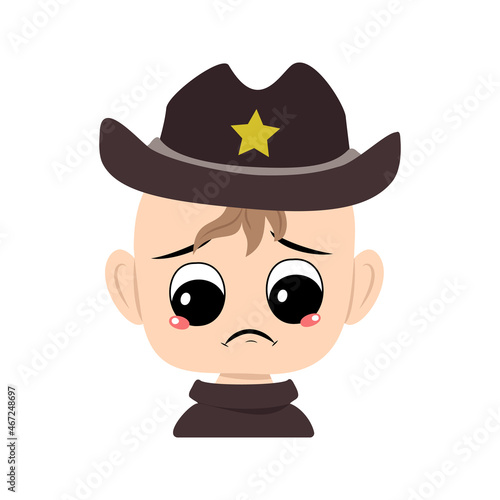Boy with crying and tears emotion, sad face, depressive eyes in sheriff hat with yellow star. Head of cute child with melancholy expression in carnival costume for the holiday
