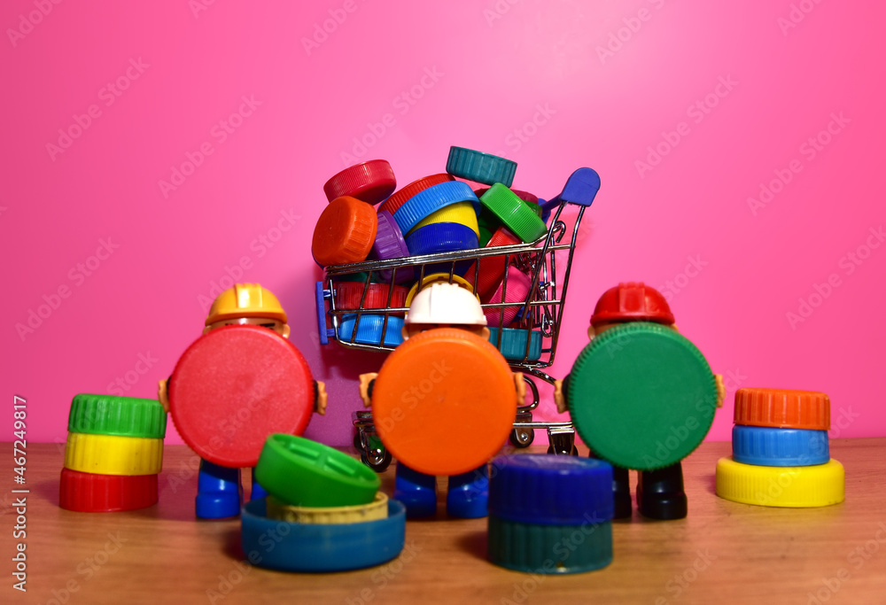 Plastic bottle caps for recycling. Cap material acceptance of plastic recyclable materials for