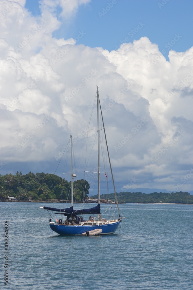 Sorong, West Papua, Indonesia, September 16th 2021. A beautiful little yacht is mooring at the sea. Raja Ampat tourism purpose. Sorong, West Papua, Indonesia, September 16th 2021. A beautiful little yacht is mooring at the sea. Raja Ampat tourism purpose.