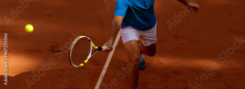 Male tennis player in action on the court on a sunny day. Horizontal sport poster, greeting cards, headers, website  and app © Augustas Cetkauskas