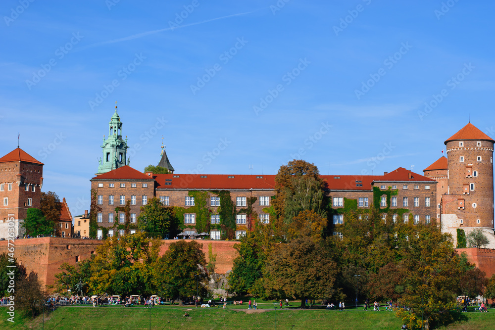 panorama of Wawel Royal Castle facade in Krakow Poland on warm sunny autumn day with clear blue sky