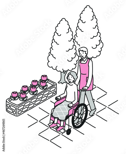 車椅子のシニア女性と男性介護士