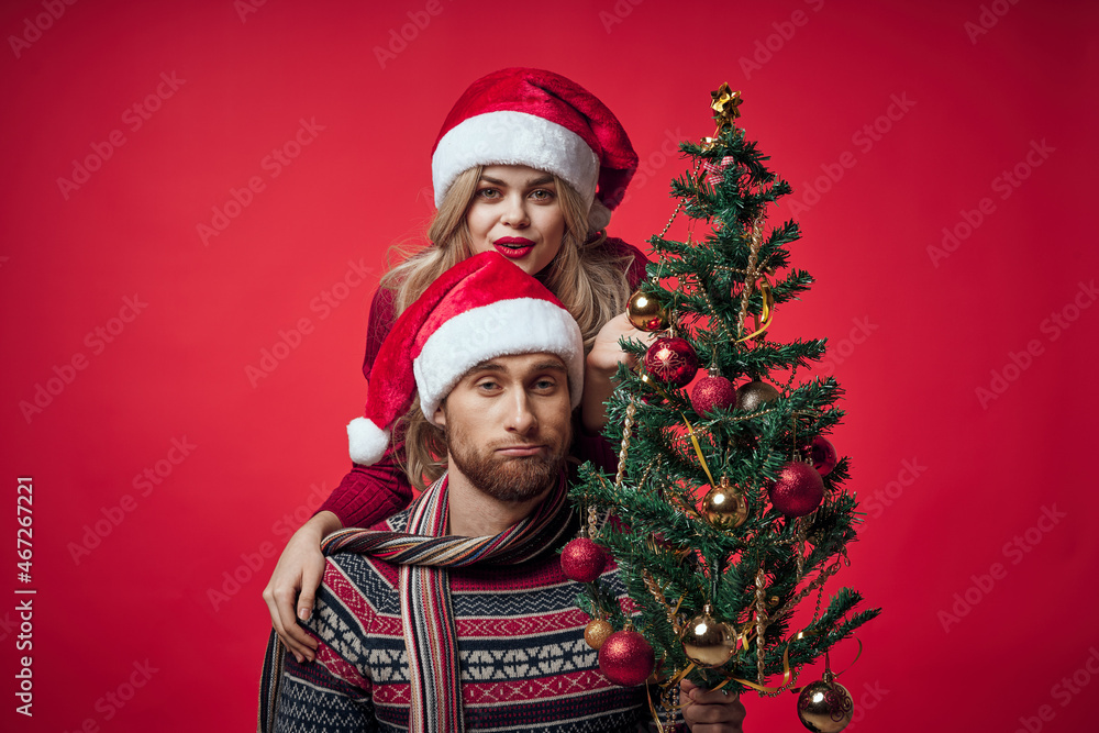 man and woman christmas clothes holiday gift red background
