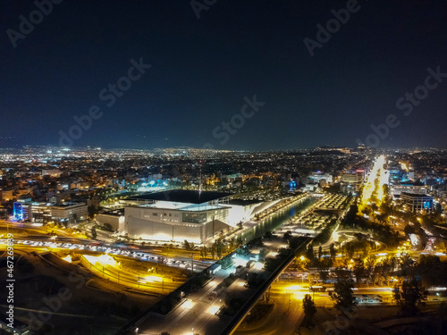 Aerial cityscape view of southern Athens at night.