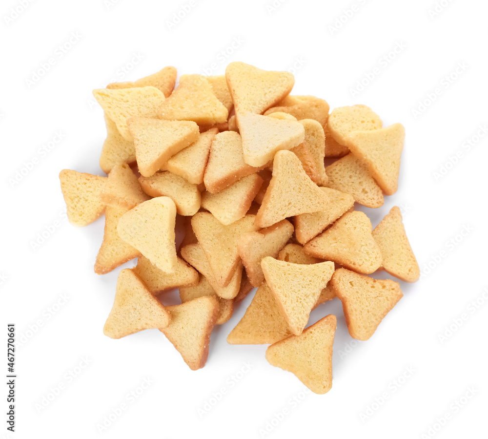 Pile of delicious crispy rusks on white background, top view Pile of delicious crispy rusks on white background, top view