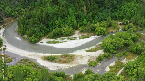 Wallpaper Mural Aerial: Panning Scenic Shot Of River Flowing By Green Forest, People Exploring During Vacation - Aukland, New Zealand Torontodigital.ca