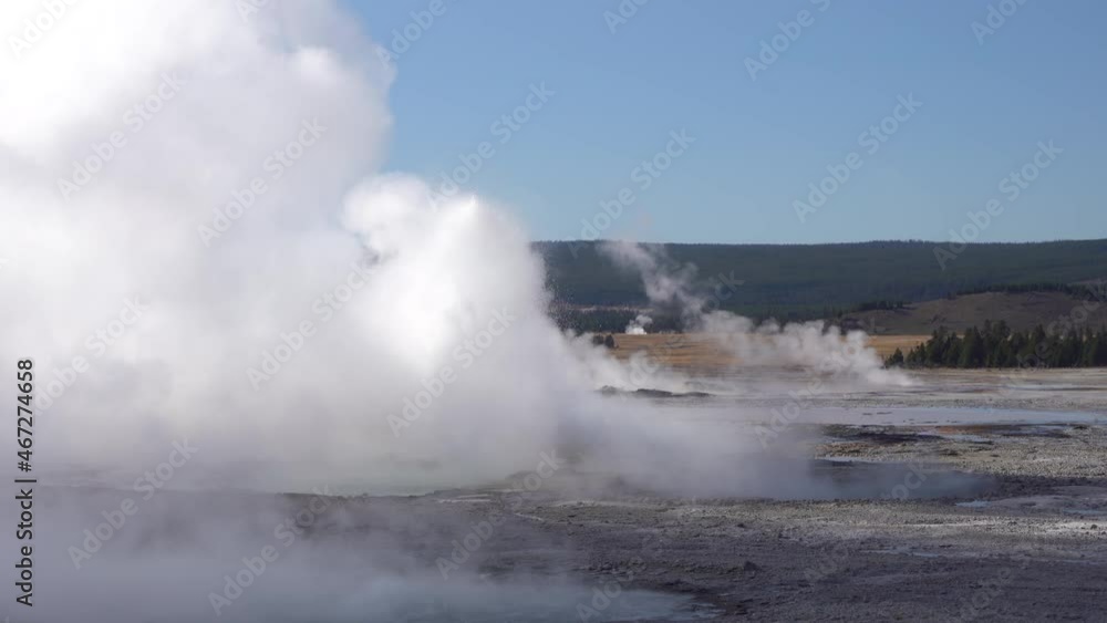 Erupting Geyser and Steam in Yellowstone National Park, Wyoming USA Erupting Geyser and Steam in Yellowstone National Park, Wyoming USA