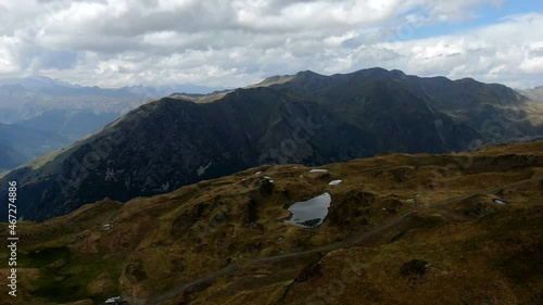 Small lakes in Aran Valley on a cloudy day. Aerial Hyperlapse of Baqueira-Beret, in the middle of the Pyrenees. photo