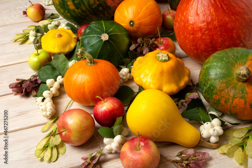 Fototapeta Naklejka Na Ścianę i Meble -  Fall arrangement with pumpkins, yellow, green squashes and gourds