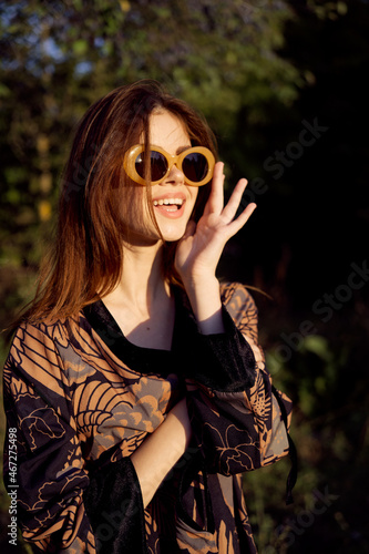 pretty woman wearing sunglasses outdoors fashion nature