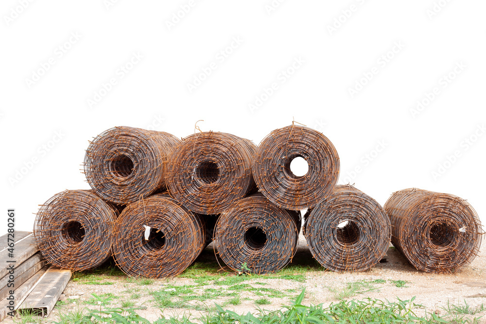 Stack of Steel mesh rolls that rust and steel plate for building structure concrete road in the construction site.