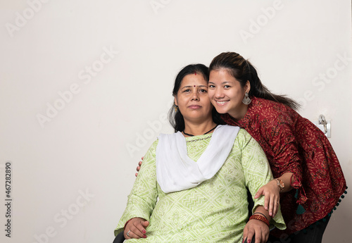 A portrait of a young indian girl with her mother, mother and daughter love