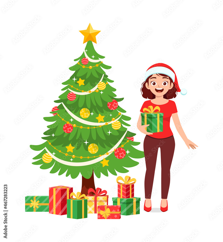 young woman holding box present in christmas