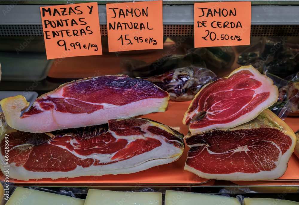 Carved pieces of Spanish jamon iberico ham with price tags specifying ...